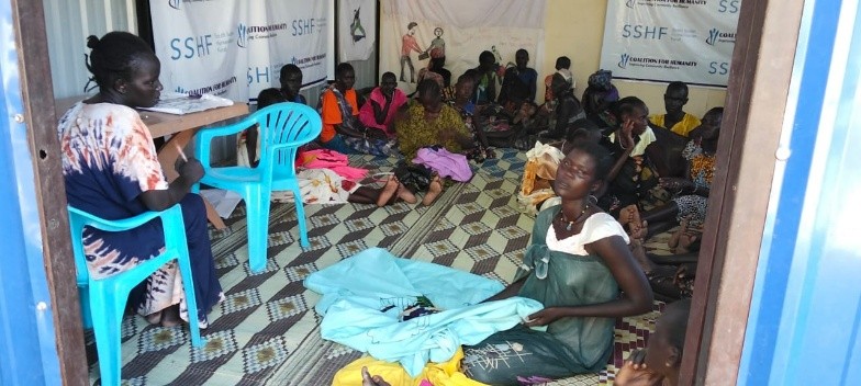 Mary Nyajal Both (left), a survivor of gender-based violence from Toch Payam, Fangak County, South Sudan, participating in a group psychosocial support activity at the CH-supported Women and Girls Friendly Centre in Toch.